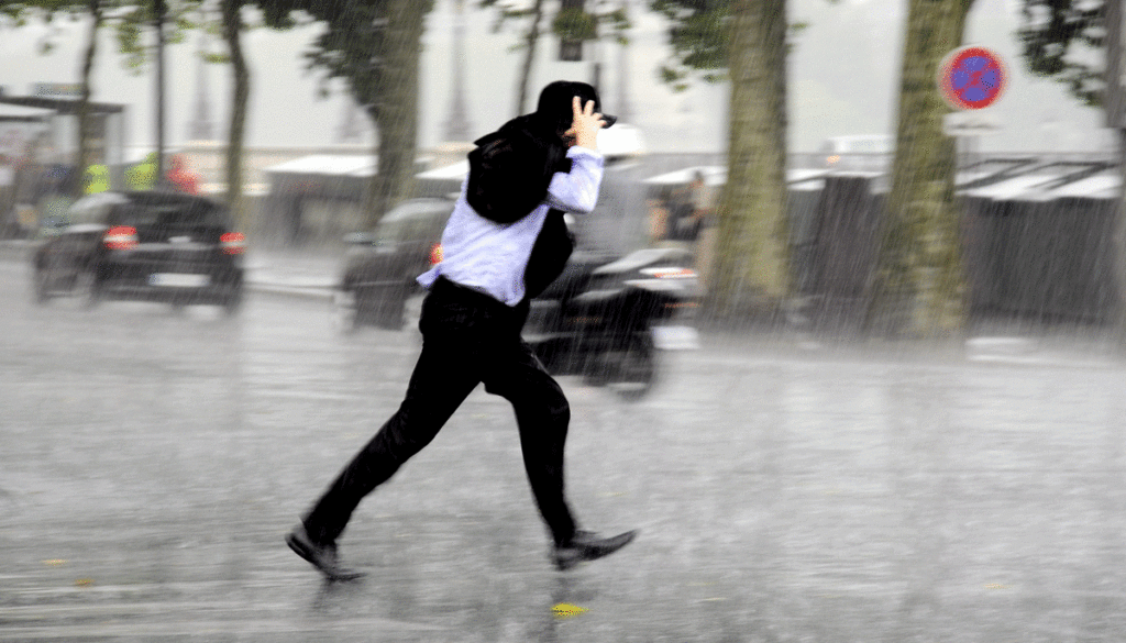 man-running-in-a-rain-storm