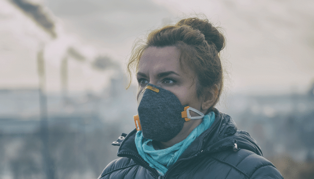 woman-wearing-face-mask-with-factory-smog