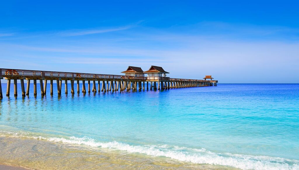 Naples Pier and beach in florida USA sunny day