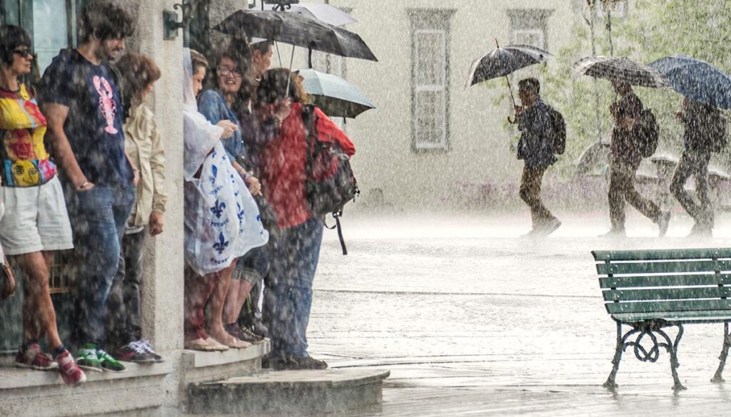 People sheltering during a heavy downpour